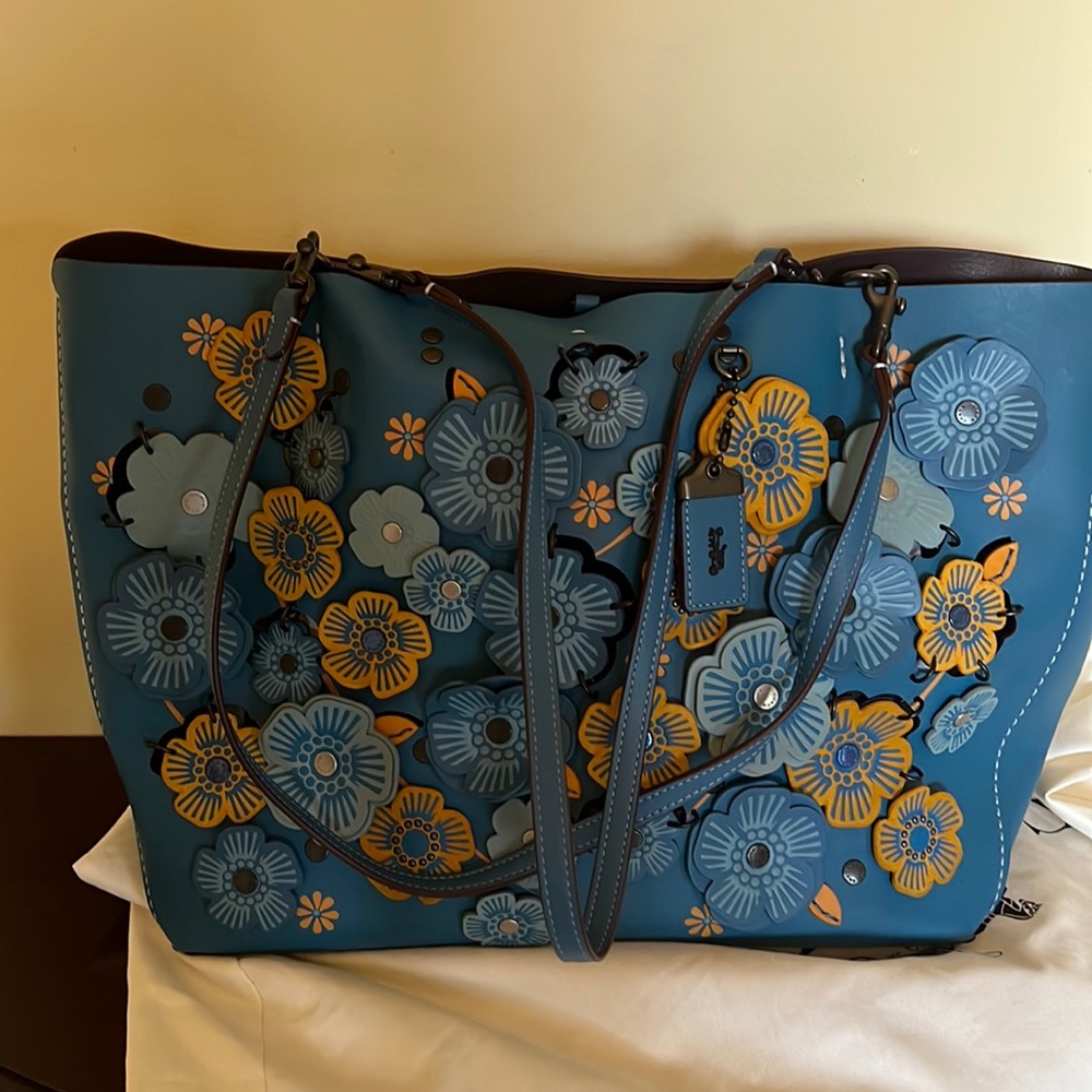 Coach leather tote with flower appliqués